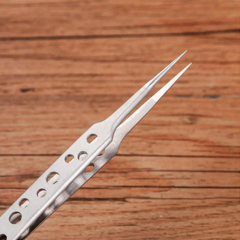 Close-up of stainless steel tweezer tip from Five Piece Stainless Steel Tweezers Set For Electronics Repair And Crafting With Anti Slip Grip Non Magnetic Tips Rust Resistant Build Pro Grade For Soldering Jewelry Making DIY Projects Tiny Parts Handling
