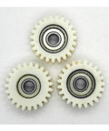 Three Pack 38mm 23-Tooth Nylon Gearbox Bearings For Electric Bike Motors, 8mm Bore, arranged in a triangle on a white background.