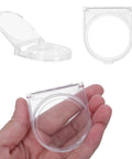 Clear industrial power button cover with adhesive panel mount for safety, shown open and closed in hand