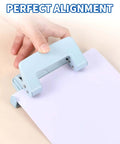Two-Hole Paper Puncher With Adjustable Guide and Labor-Saving Handle, Heavy-Duty 5-Sheet Capacity Office Punch For Binders And Loose-Leaf, Durable Metal Construction Delivers Precise 0.23 Inch Holes Every Time, Real Workhorse Tool, Blue in use with paper