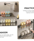 Self Adhesive Bathroom Wall Towel Rack in Gray No Drill Metal Organizer with hooks holding towels and slippers, installed view