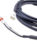 Close-up of servo motor brake cable: white 2-pin plug on a long black cable with white and black leads ending in red crimp connectors.