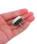 Hand holding an Anti Slip Furniture Pad With Nail On Glide For Chairs And Tables, Rubber And Steel Construction, Easy Install