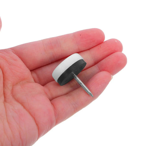 Close-up of Anti Slip Furniture Glide Pads For Chairs And Tables With Nail On Design Heavy Duty Rubber And Steel Construction in hand