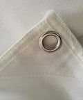 Close-up of heavy duty canvas material with grommet, from 58 by 58 inch Golf Target Cloth for Indoor and Outdoor Practice.