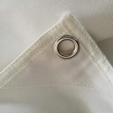 Close-up of heavy duty canvas material with grommet, from 58 by 58 inch Golf Target Cloth for Indoor and Outdoor Practice.