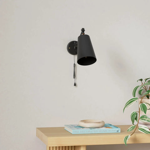 Two Pack Industrial Plug In Wall Sconces With On Off Switch Vintage Edison Swing Arm Black Metal Shade For Home Or Office 55 Inch Cord Two In One Plug In Or Hardwire mounted above a wooden table with decor