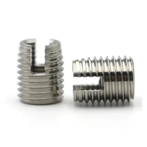 Heavy Duty Self Tapping Thread Inserts M2 To M16 In Carbon And Stainless Steel With Yellow Zinc Plated Or Silver Finish For Hardcore Thread Repair Jobs On Cars And Home Appliances Pack Of Two Awesome Gear close-up of two stainless steel thread inserts.