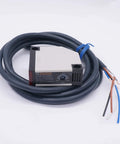 Plug-And-Play Photoelectric Beam Sensor Switch With 30cm Detection Range Diffuse Reflection Infrared Proximity Sensor For Industrial Control 12-240VDC And 24-240VAC Compatible E3JK-DS30M1, showing device and attached cables