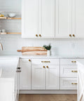 White kitchen with 6 pack antique brass cabinet handles zinc alloy drawer pulls for kitchen and furniture, 5.04 inch center to center.