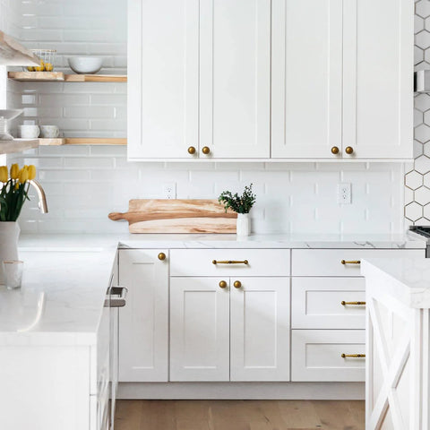White kitchen with 6 pack antique brass cabinet handles zinc alloy drawer pulls for kitchen and furniture, 5.04 inch center to center.