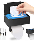 Close-up of Matte Black Stainless Steel Toilet Paper Holder With Shelf And Wipes Dispenser showing wipes being dispensed
