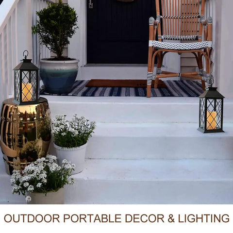 Vintage 13.5 Inch Lantern Set With Realistic LED Pillar Candle Black Finish on porch steps with plants