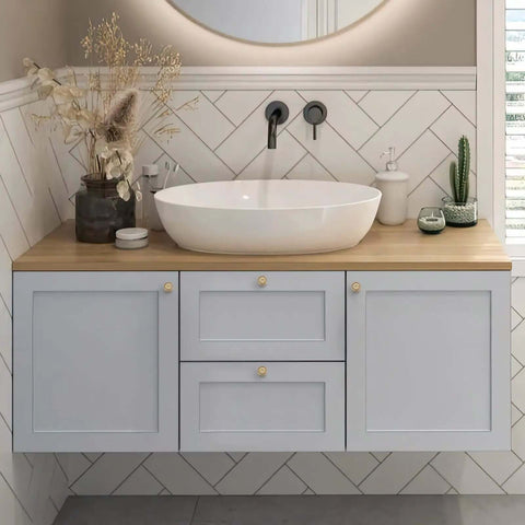 Bathroom vanity with Vintage Rosette Sunburst Cabinet Knobs In Champagne Bronze Finish, 1-1/4 inch diameter, set of 30.