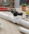 Two Pack One And A Half Inch NPT PVC Ball Valves Double Female No Fuss Full Port Shut Off Valve visible in plumbing setting