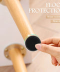 10 Pack Heavy Duty Stainless Steel Adjustable Furniture Leveling Legs With Swivel Base Crushes Stubborn Wobbles Fast And Serves As Premium Floor Savers To Silence Annoying Creaks While Providing Rock Solid Stability For Daily Use, close-up of attached black foot on furniture leg.