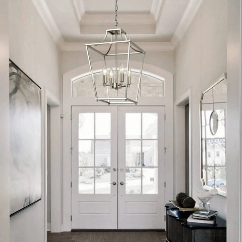 4 Light Lantern Pendant In Brushed Nickel E12 Base Chandelier for dining room kitchen and foyer, hanging in a bright foyer