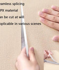 Hands cutting Stress Free Peel And Stick Wallpaper Roll, Removable Self Adhesive Vinyl With Thick Insulation Backing, DIY Accent Wall Glow Up For Laidback Home Vibes, Soft Pink Concrete Texture, Nine Millimeter.