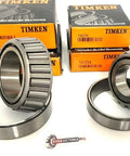 TIMKEN bearing replacement set with two tapered roller bearings and steel races; orange Timken boxes in background