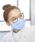 Person wearing All Day Anti Fog Safety Glasses With Blue Light Protection For Men And Women Scratch Resistant Lenses Lab Goggles