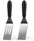 Two mini spatulas for kitchen use; black-handled stainless steel blades, one slotted, one solid.