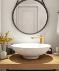 Gold Vessel Sink Faucet in Brushed Gold Finish with white vessel sink on wooden vanity in bathroom setup