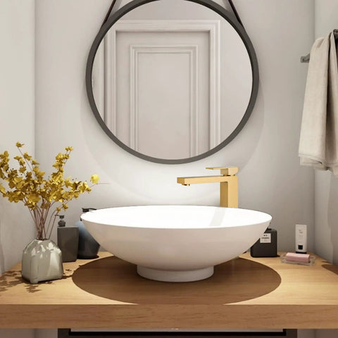 Gold Vessel Sink Faucet in Brushed Gold Finish with white vessel sink on wooden vanity in bathroom setup