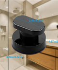 Black suction cup handle for glass surfaces and smooth walls with dimensions in bathroom setting, tool-free installation.