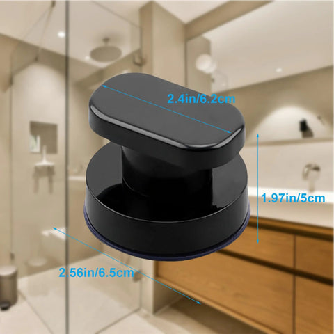 Black suction cup handle for glass surfaces and smooth walls with dimensions in bathroom setting, tool-free installation.