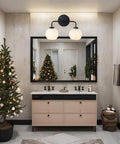 Double Glass Globe Wall Sconce, 17 Inch Sleek Modern Design in Matte Black over bathroom vanity mirror, holiday decor visible