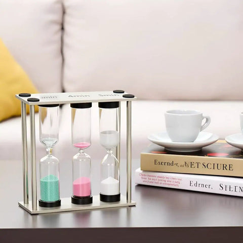 Go To Desk Timer With Brushed Stainless Steel Frame three in one 3 4 5 minute kitchen timers on a table with books and cups