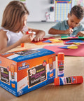 Kids crafting with Disappearing Purple School Glue Sticks 7 Grams, 30 Count Pack For Classrooms, Mess-Free, Washable, Dries Clear.