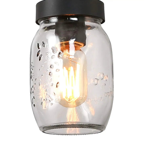 Glass pendant from Rustic Mason Jar Chandelier For Farmhouse Kitchen Island Lighting with clear jar and exposed bulb.