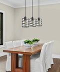 Two Pack Black Spiral Cage Pendant Lights With Clear Glass Shade And Frosted Inner Glass over dining table
