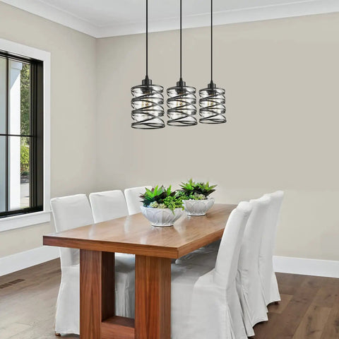 Two Pack Black Spiral Cage Pendant Lights With Clear Glass Shade And Frosted Inner Glass over dining table