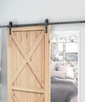 Sliding Barn Door Stopper Rail Stop For Single Or Double Doors, Top Flat Track And Center Or End Install, Adjustable Fit For 1.57 Inch Width Tracks 40mm, Black Satin Aluminum Alloy Construction, Corrosion Resistant, 1 Pair, installed on a wooden sliding door.