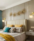 Bedroom with Lit Water Ripple Lampshade Double Gold Wall Sconce Set Dope Luxury Antique Brass Metal Wall Light on each side of bed