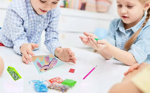 Children crafting with Six Pack 5D Cartoon Diamond Painting Kits For Kids Beginners With Cute Animals on a table