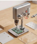 Ace Mini Bench Drill Press Delivering Sweet Variable Speed Control With Heavy Duty Chuck Grip For Zero Drama Woodworking Metal Drilling And Quick Jewelry Crafting Jobs placed on a wood surface with various materials.