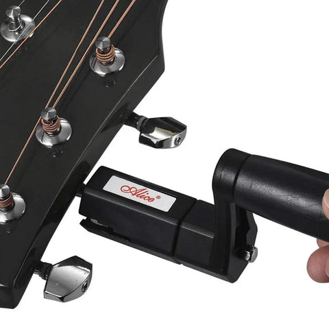 Legit Guitar String Winder Bridge Pin Puller Tool For Musicians Detachable Hand Crank in use on guitar headstock.