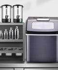 Killer Countertop Ice Maker Drops 55 Pounds Of Cubes Daily With Zero Hassle featuring a sleek design on a kitchen counter.
