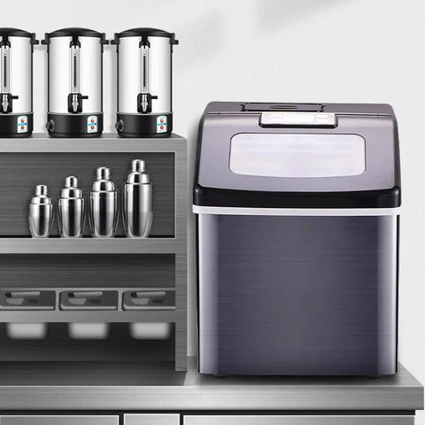 Killer Countertop Ice Maker Drops 55 Pounds Of Cubes Daily With Zero Hassle featuring a sleek design on a kitchen counter.