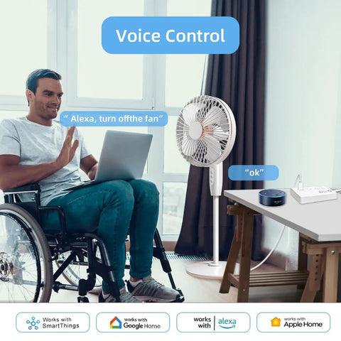 Man using laptop in wheelchair, controlling fan with voice command, showcasing Straight Up Badass Smart Power Strip Running On Matter Tech For Apple HomeKit Alexa Google Home And SmartThings With Four AC Outlets Dual USB C Charging And Long Cable For Your Sweet Home Setup.