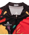 Close-up of a colorful cycling jersey with red, yellow, and black floral patterns and a zippered front.