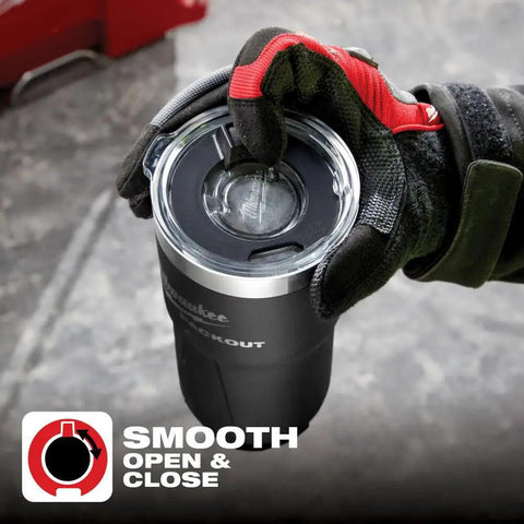Gloved hand holding Packout Insulated Tumbler 890 Ml Black With Two Wall Vacuum Insulation and Twist to Lock Connectivity.