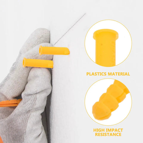 Heavy Duty Yellow Self Drilling Wall Expansion Anchor Kit, 200 Pack in use on wall, glove holding a yellow plastic anchor