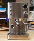Top Tier Dual Boiler Espresso Maker With Smart Thermoblock And Precise PID Temp Control featuring a 58mm portafilter in glossy stainless steel.
