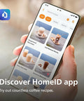 Person holding a smartphone displaying HomeID app with coffee recipes including iced coffee and latte macchiato.
