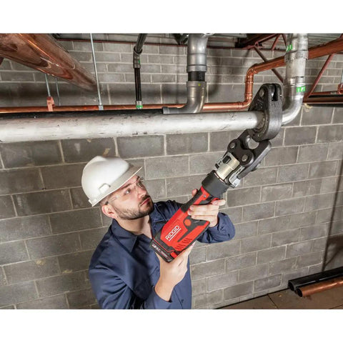 Plumber using ProPress RP 351 Press Tool Kit With 18V Battery Charger MegaPress Jaws for copper pipe installation
