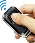 Close-up of a hand holding a remote from the 2.4GHz WiFi Remote Access Control System With 600Lb Magnetic Door Lock Kit for easy use.